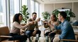 © Himatul - Diverse team of successful business professionals celebrating with coffee in a modern bright office lounge