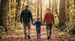 © James - Family Walking Hand in Hand Through a Sunlit Autumn Forest