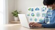 © Elias - Young man working on laptop with green energy icons, sustainable technology and renewable power concept for environmental protection and digital innovation in modern office work...