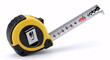 © Mustadir - Yellow retractable tape measure extended on a white background showing metric measurements.