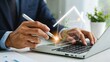 © Ansar - Businessman using laptop with digital house approval and real estate concept