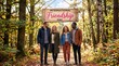 © Mitali Creative  - Four diverse friends walking together on a forest path under a hanging wooden sign that reads international friendship day with autumn leaves and tall trees in the background during the daytime