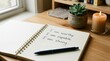 © Mahin Creatives-HQ - World Mental Health Day Open notebook with handwritten positive affirmations on wooden desk with succulent and candle representing self care and mindfulness