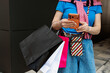 © Nata Segueza/Stocksy - A man with bags and a phone in his hands
