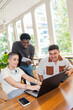 © Luis Velasco/Stocksy - Group of Friends Working Together in a Modern Office Space