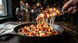© Abdul - pizza in the restaurant Delicious hot pepperoni pizza on a table with a slice being pulled up showing stretchy cheese.