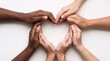 © Mikhail - Diverse hands forming a heart shape together on white background. Group of people showing unity, connection and inclusion. Global community, support and equality symbol for charity.