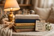 © NOR - Stack of books with glasses and lamp