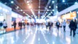 © nanskyblack - Soft blurred exhibition center with professional visitors and commercial event atmosphere