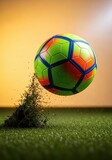 A soccer ball is forcefully launched from the turf of a stadium field, capturing the intense motion and impact of a powerful goal kick, shoe, speed, victory