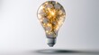 © Lebah - Cracked lightbulb glows with internal bright golden illumination
