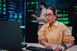 © Zamrznuti tonovi - Woman engineer working on computer in data center, managing server racks and cloud computing infrastructure