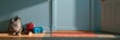 © CREATIVE STOCK - Backpack, lunch box, and shoes placed against a blue wall in a hallway, back to school banner