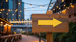 © Team Work - Wooden signpost with glowing yellow arrow. Directional marker illuminated at dusk for clear guidance. Urban navigation aid for pedestrians and tour...