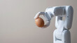 © newlifestock - Robot arm holding brown egg with ai technology and safety concept for delicate handling and precision in automation