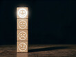 © Sabrina - Wooden blocks with different emoticon faces on a dark background