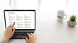 © yayan - Person using laptop for online research and learning.