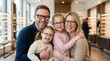 © Masque - Happy caucasian family of four wearing eyeglasses and smiling together.