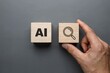 © ProfessorWorld - Hand Placing Wooden Blocks with AI and Search Icons on Gray Surface for Artificial Intelligence Concept