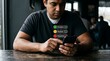© Arif - Man giving negative feedback on a mobile device with emoticon ratings