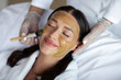© Home-stock - Happy woman receiving professional facial mask as beauty specialist gently treating her skin, closeup shot