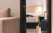 © Westend61 - Businessman relaxing on bed at hotel room