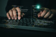 © khunkornStudio - programmer hands typing computer keyboard pointing glowing code hologram virtual screen software development web programming cybersecurity digital technology hacker coding script HTML CSS network