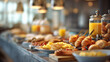 © KotBaton - Elegant breakfast buffet with croissants, pancakes, scrambled eggs, fresh berries and orange juice served in a modern luxury hotel restaurant. Gourmet brunch and hospitality concept.