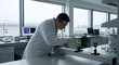 © Phatcharin - Scientist using green laser on optical equipment in laboratory