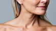 © Newleks - Mature woman showing her neck and decolletage, revealing aging skin with wrinkles and sagging, highlighting concepts of skincare, dermatology, and beauty concerns