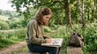 © Marin Studio - Creative teenager sketching in nature during a sunny day