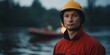 © JPminimal - Close up of a weary rescue worker standing in flood water showcasing determination and strength during a challenging situation