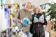 © JackF - Couple elderly man and woman buyers choosing laundry detergent and cleaning spray in household chemicals store