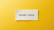 © NFTNexus - Torn Paper Note with the Phrase Story Told on a Bright Yellow Background