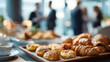 © KotBaton - Breakfast buffet with pastries and coffee served during a corporate networking event. Business hospitality, conference catering and professional meeting concept.