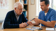 © Matos - Doctor shows elderly patient how to use insulin pen for diabetes management
