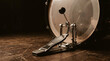 © MUHAMMAD - Professional bass drum pedal and percussion kit on dark wooden floor in a music studio