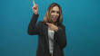 © Krakenimages.com - Woman pointing finger upward with other hand pointing to it, smiling and looking at finger, wearing pinstripe blazer and white top in studio; playful invitation.
