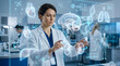 © Don - Female doctor using digital medical interface with holographic anatomy displays in modern clinic