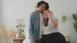 © Krakenimages.com - Woman holding keys and hugging partner in studio while man kisses her forehead and she shows key to camera; new home joy.