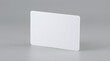 © Sido - Blank White Rectangular Card with Rounded Corners Leaning Slightly Against a Neutral Gray Background Casting a Soft Shadow