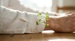 © nurul - Green sprouts growing from the sleeve of a man wearing a white shirt