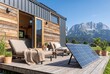 © Alivo17 - Modern tiny house with solar panels on a wooden deck. Sustainable off-grid living in the mountains. Contemporary small home architecture with mountain view