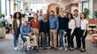 © Felippe Lopes - Diverse group of smiling professionals including individuals with disabilities in a modern office setting