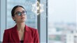 © joeycheung - Professional woman in red blazer gazes at floating geometric data structures.