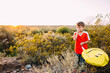 © Natalie Wheeler - boy in desert holding balloon about to sneeze
