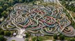 © wan - High angle shot of an immense, colorful tangled walkway maze and intricate path network in a park, featuring a wooden sign reading 'FIND YOUR WAY' in the foreground for navigation.