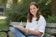 © Fathur - Joyful Teen Artist Sketching in Park