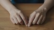 © warana - Close-up of Woman s Hands Resting on a Wooden Table Surface in a Minimalist Setting with Soft Natural Lighting and Warm Tones, Concept of Calmness and Stillness with Copy Space