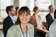 © Westend61 - Smiling female entrepreneur with colleagues at educational event